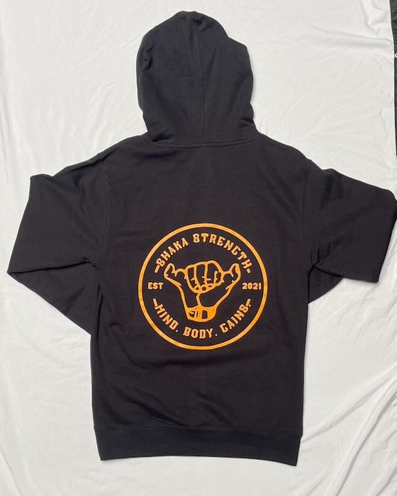 Back of the black Shaka Strength hoodie with the large gold logo